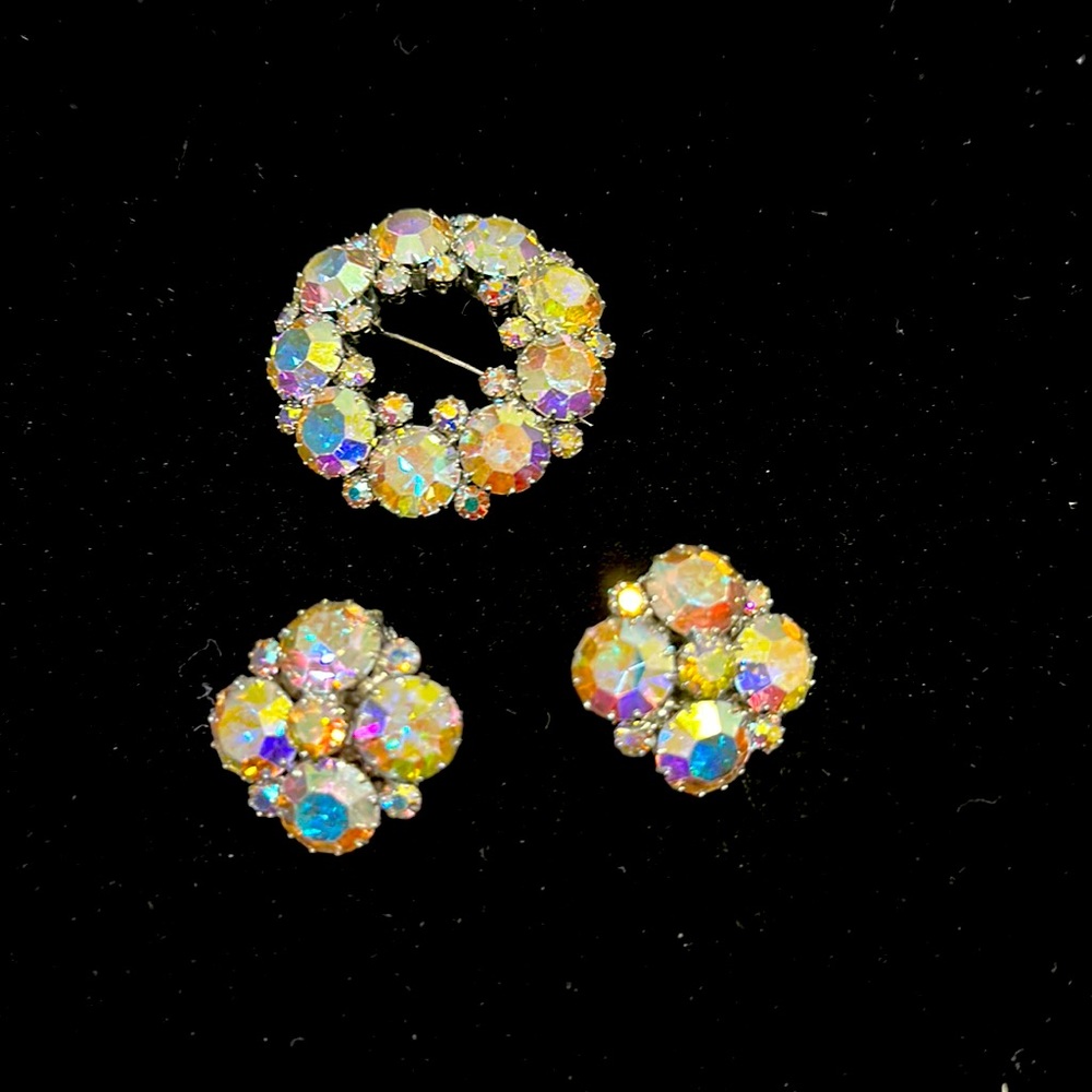 Brooch and clip on earrings set.   In perfect condition.